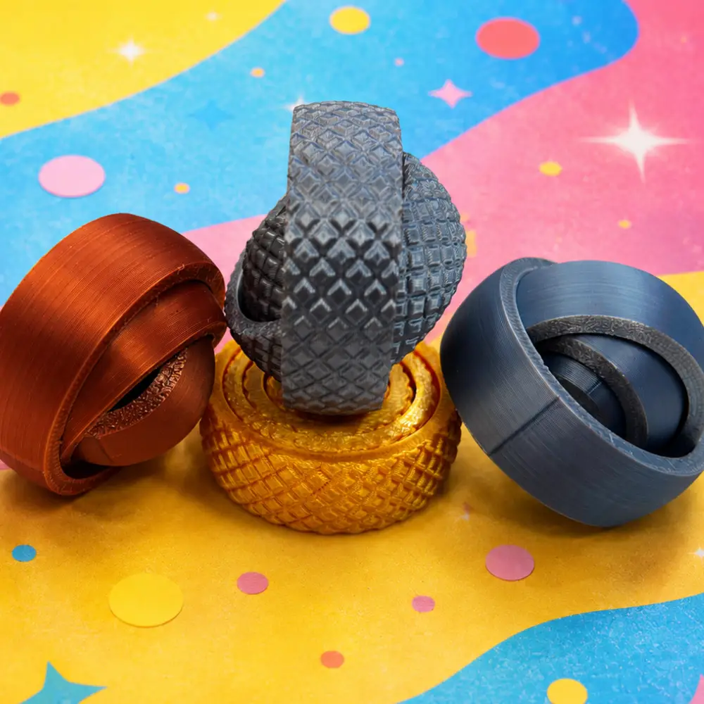Objeto táctil con anillos giratorios que relaja y favorece la concentración.